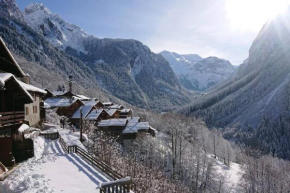 Mountain house with two barns and a garden